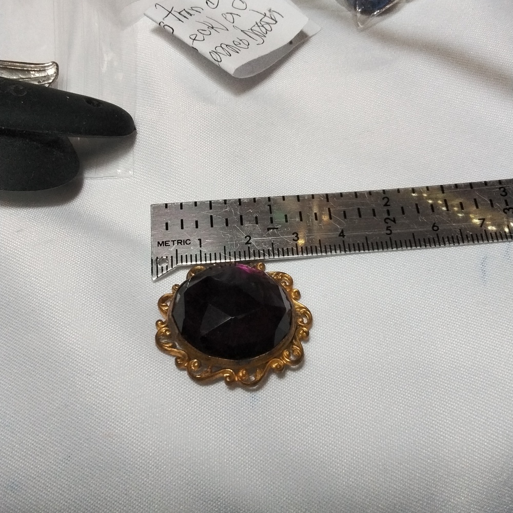 Purple round brooch